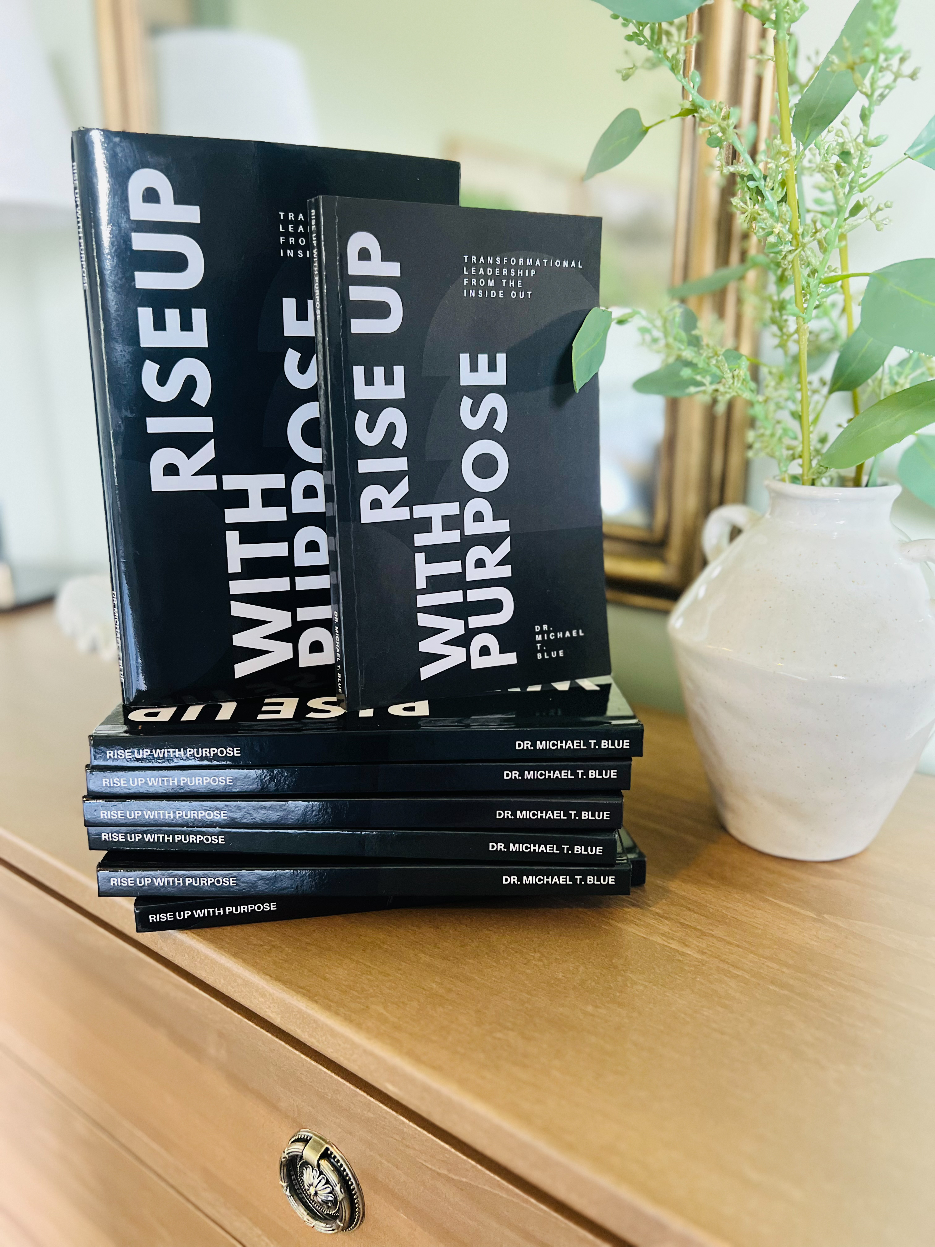 Rise Up With Purpose, signed copies stacked